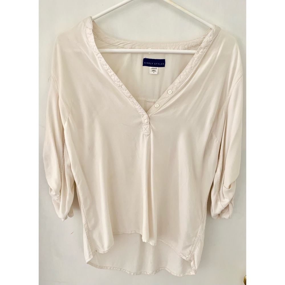 Cream color half sleeve blouse.